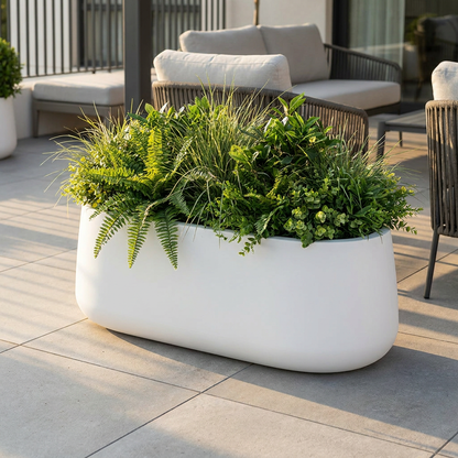 Jardinera Decoluxe L en terraza moderna