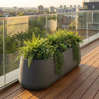 Jardinera Decoluxe XL en terraza con barandilla